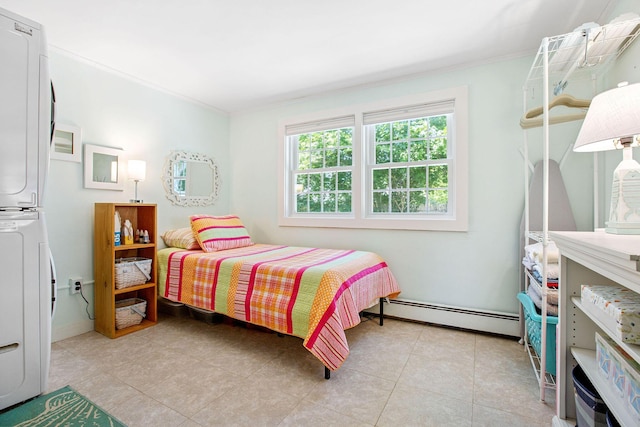 31 Chase St, Dennis Port, MA 02639 - bedroom featuring a baseboard radiator, stacked washing machine and dryer, ornamental molding, and light tile patterned floors
