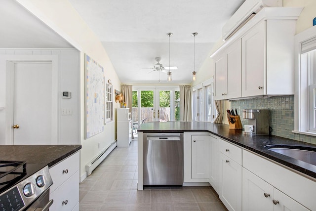 31 Chase St, Dennis Port, MA 02639 - kitchen with stainless steel appliances, a baseboard radiator, a ceiling fan, a peninsula, and white cabinetry