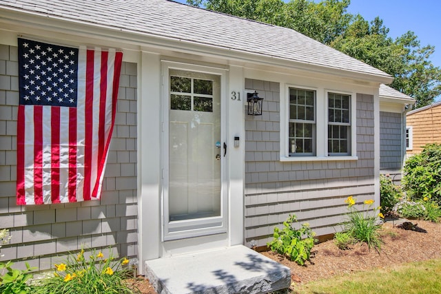 31 Chase St, Dennis Port, MA 02639 - view of exterior entry with a shingled roof