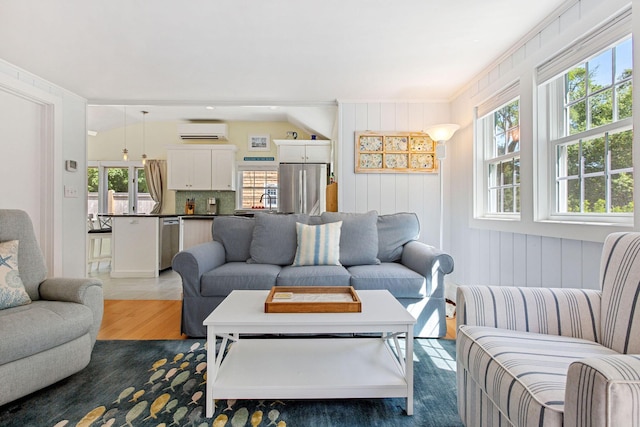 31 Chase St, Dennis Port, MA 02639 - living room with a wall mounted AC and wood finished floors