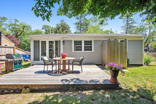 31 Chase St, Dennis Port, MA 02639 - back of house with a wooden deck and outdoor dining space