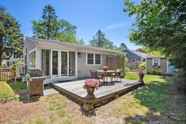 31 Chase St, Dennis Port, MA 02639 - back of property featuring a wooden deck, outdoor dining area, and a storage shed