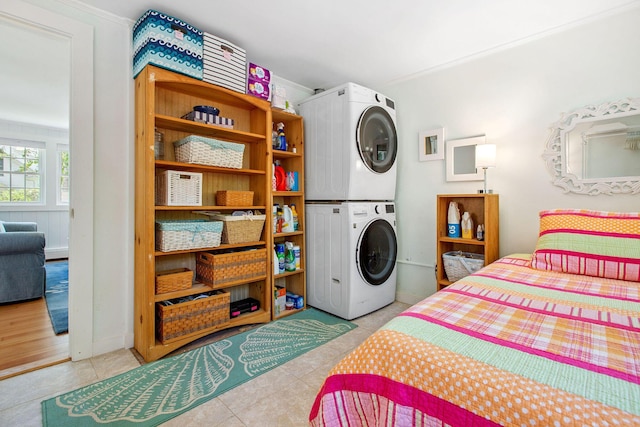 31 Chase St, Dennis Port, MA 02639 - bedroom with estacked washer and dryer, ornamental molding, and tile patterned flooring