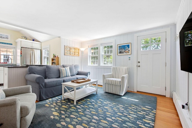 31 Chase St, Dennis Port, MA 02639 - living room featuring a baseboard heating unit and wood finished floors