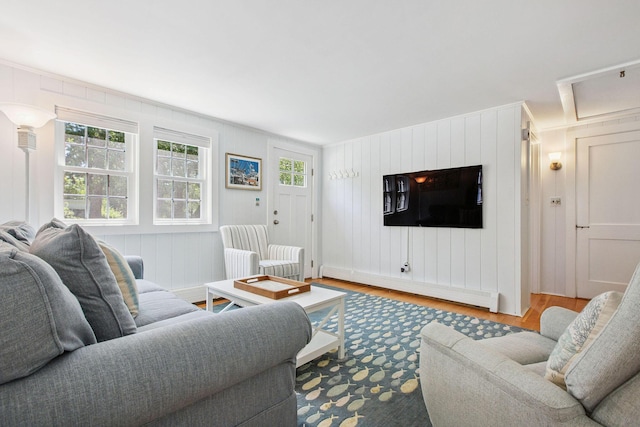 31 Chase St, Dennis Port, MA 02639 - living area with a baseboard heating unit and wood finished floors