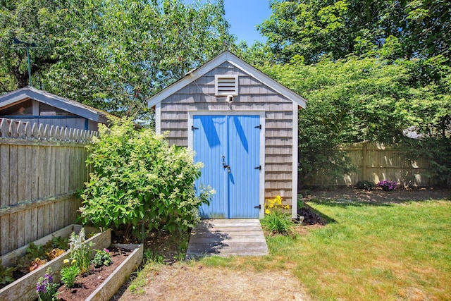 31 Chase St, Dennis Port, MA 02639 - view of shed featuring a fenced backyard and a garden