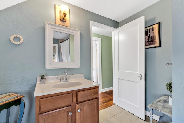 bathroom with vanity and tile patterned flooring