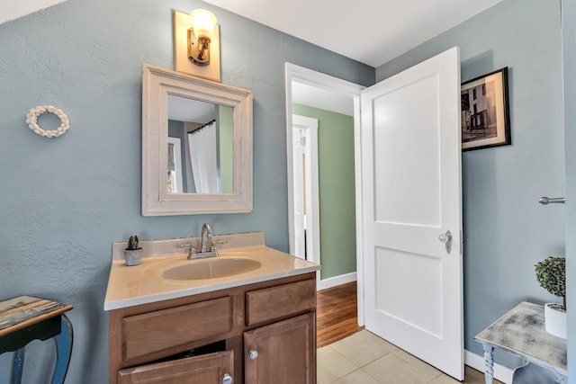 bathroom with vanity and tile patterned floors