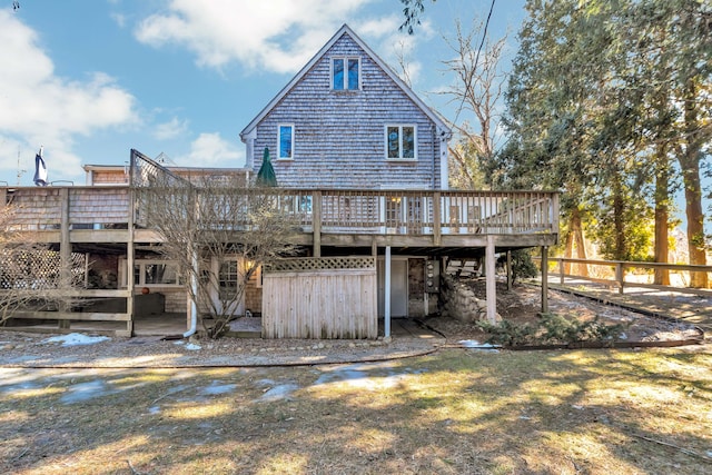 back of house with a lawn and a wooden deck