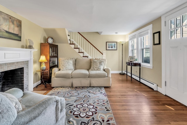 living room with dark wood-type flooring and a baseboard radiator