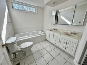 bathroom with tile patterned flooring, toilet, a sink, a bath, and double vanity