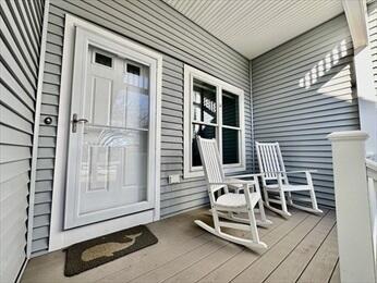 doorway to property with covered porch