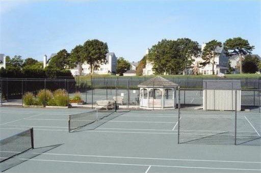 view of sport court featuring fence