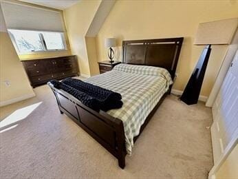 bedroom with carpet flooring and baseboards