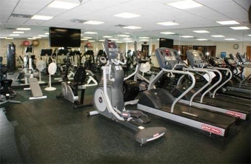 exercise room featuring a drop ceiling