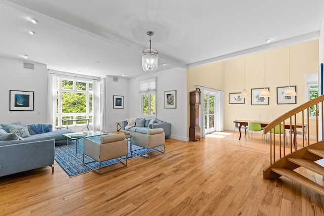 82 Harbor Hill Rd, Woods Hole, MA 02543 - living area with stairway, light wood-type flooring, a chandelier, and recessed lighting