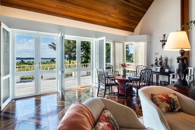 sunroom / solarium featuring wood ceiling and vaulted ceiling