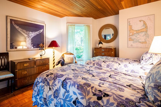 bedroom with dark parquet floors