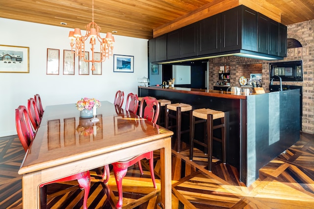 dining room featuring wooden ceiling, brick wall, a notable chandelier, and parquet flooring