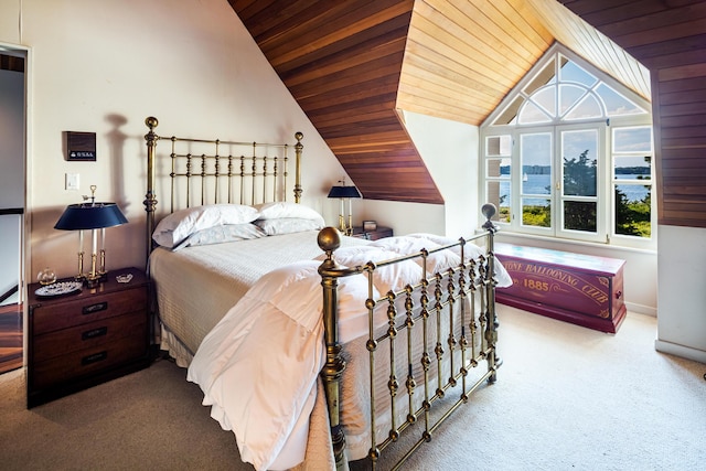 carpeted bedroom featuring vaulted ceiling and wood ceiling