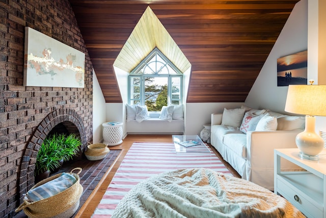 interior space featuring wood ceiling, vaulted ceiling, and a brick fireplace