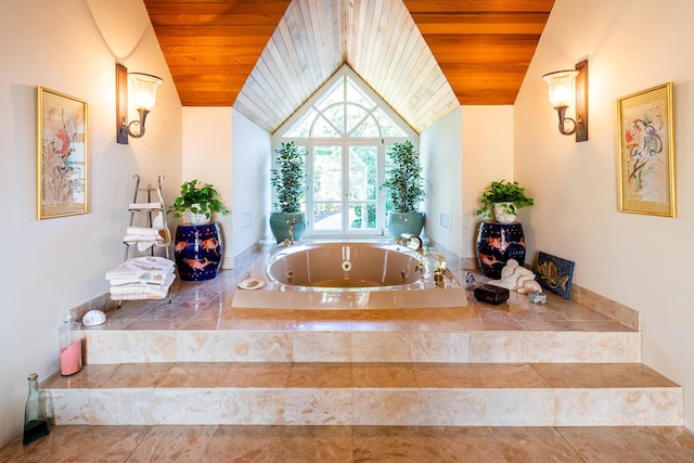 bathroom with tiled bath, wooden ceiling, and lofted ceiling