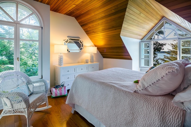 bedroom with wooden ceiling, dark hardwood / wood-style flooring, and lofted ceiling