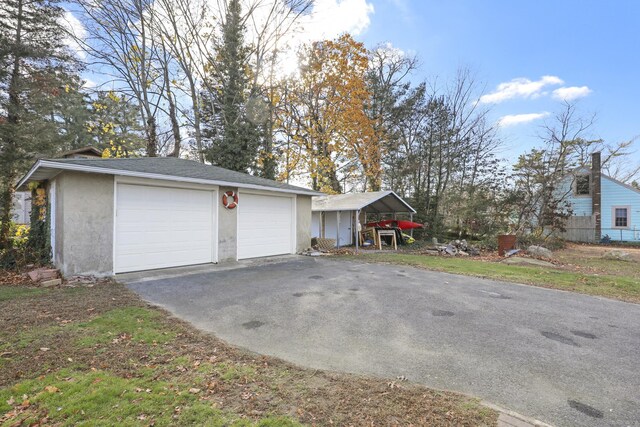 garage featuring a carport