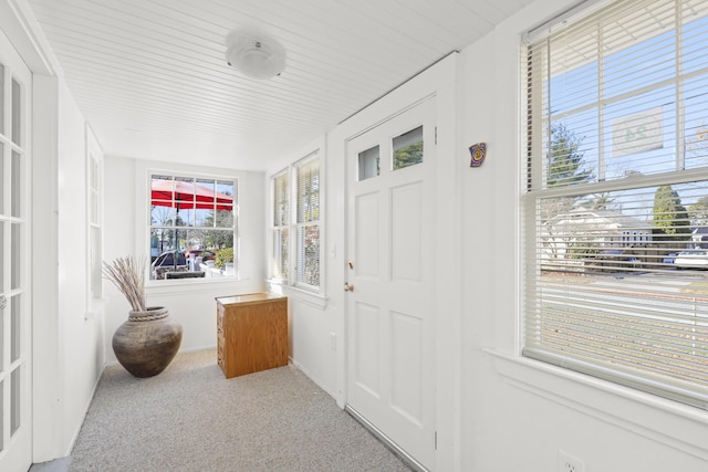 foyer entrance with light carpet