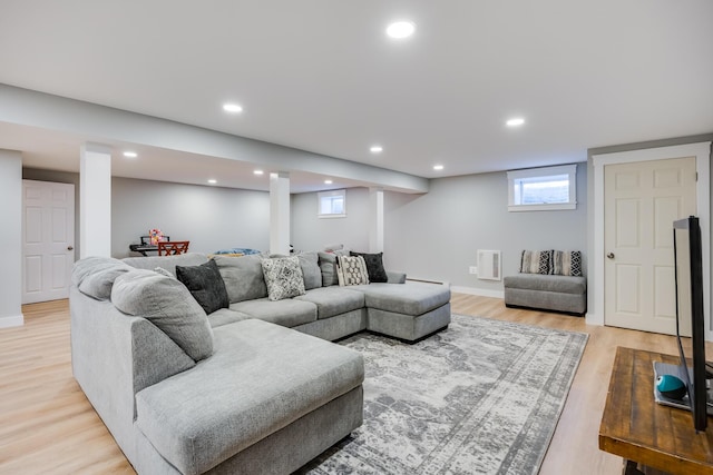 living area with light wood finished floors, visible vents, recessed lighting, and baseboards