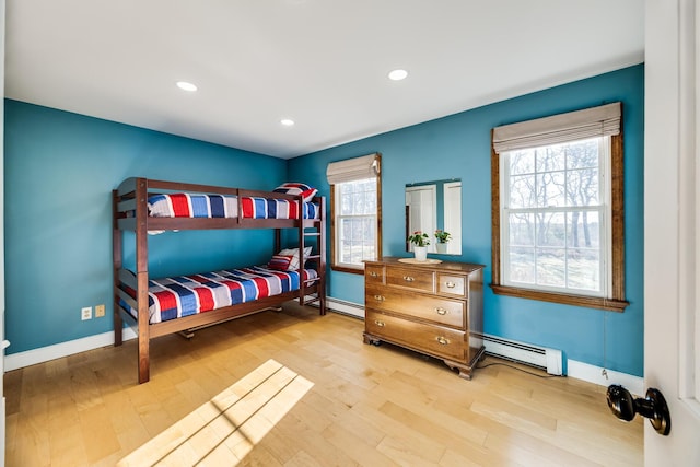 bedroom featuring recessed lighting, baseboards, and wood finished floors