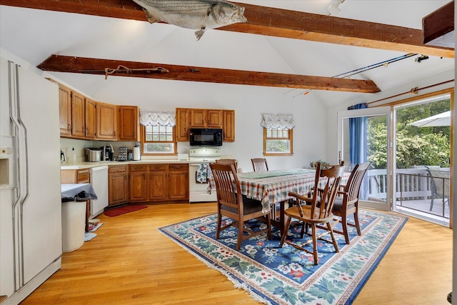 32 Purmackene Ln, Harwich Port, MA 02646 - dining space with beamed ceiling, plenty of natural light, light wood-type flooring, and high vaulted ceiling