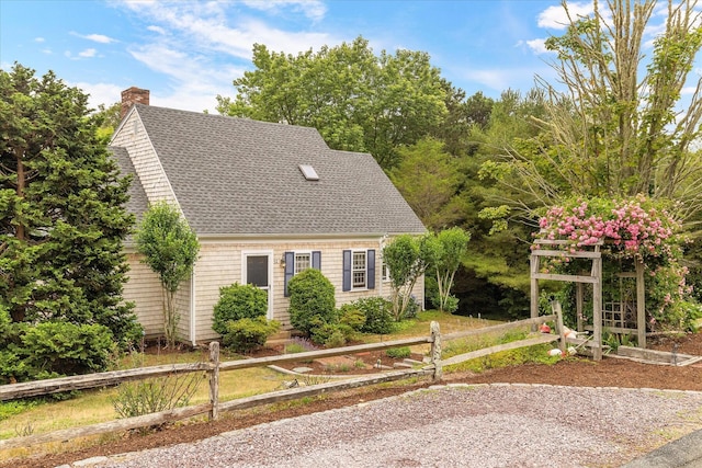 32 Purmackene Ln, Harwich Port, MA 02646 - view of front of home with roof with shingles and a chimney