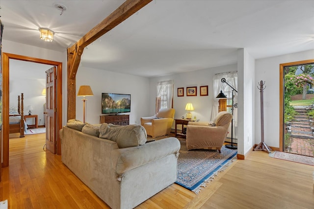 32 Purmackene Ln, Harwich Port, MA 02646 - living area with plenty of natural light, light wood-style flooring, and baseboard heating