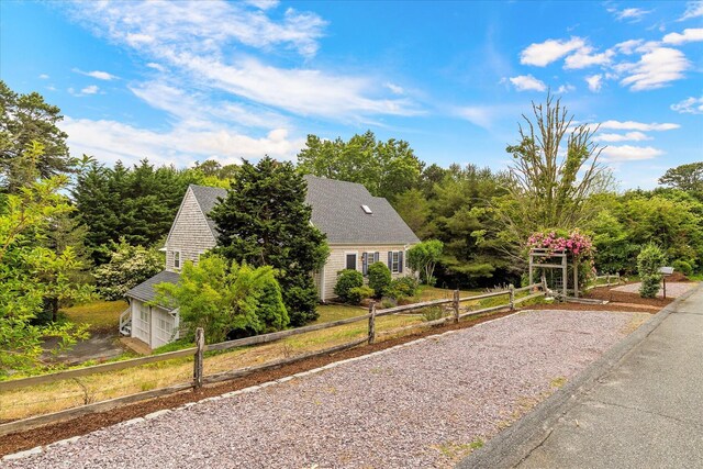 32 Purmackene Ln, Harwich Port, MA 02646 - view of front of home featuring a garage and driveway