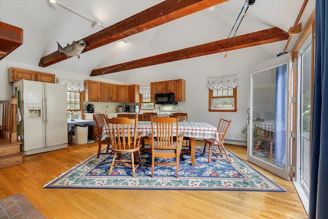 32 Purmackene Ln, Harwich Port, MA 02646 - dining area featuring track lighting, beam ceiling, light wood-style flooring, high vaulted ceiling, and a baseboard heating unit
