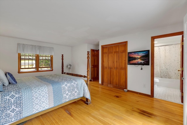 32 Purmackene Ln, Harwich Port, MA 02646 - bedroom featuring light wood-type flooring, a closet, and ensuite bath