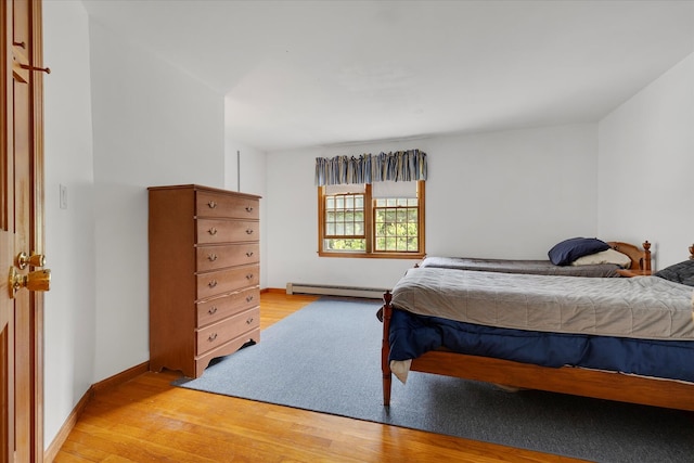 32 Purmackene Ln, Harwich Port, MA 02646 - bedroom with baseboard heating and light wood-type flooring