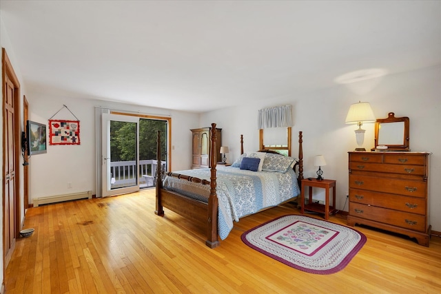 32 Purmackene Ln, Harwich Port, MA 02646 - bedroom featuring a baseboard heating unit, access to outside, and light wood finished floors