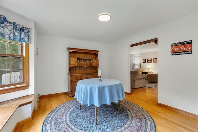 32 Purmackene Ln, Harwich Port, MA 02646 - dining room featuring light wood-style flooring and a baseboard heating unit