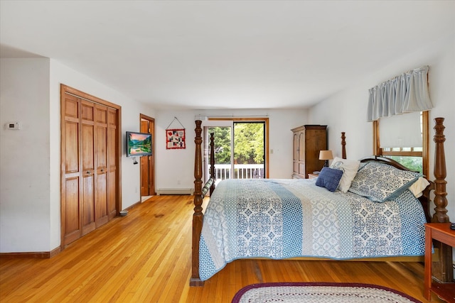 32 Purmackene Ln, Harwich Port, MA 02646 - bedroom featuring access to outside, light wood-style floors, a closet, and a baseboard radiator