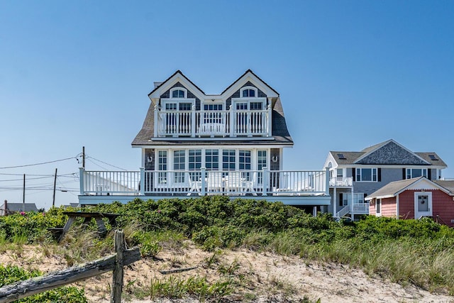 6 Baker Way, West Dennis, MA 02670 - view of front facade with a balcony and a deck