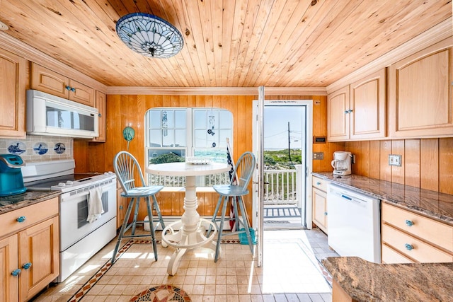 6 Baker Way, West Dennis, MA 02670 - kitchen featuring white appliances, crown molding, wooden ceiling, wood walls, and dark stone countertops