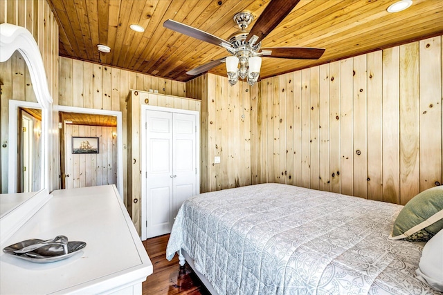 6 Baker Way, West Dennis, MA 02670 - bedroom with wood ceiling, dark wood-type flooring, wooden walls, and a closet