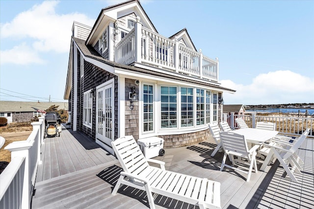 6 Baker Way, West Dennis, MA 02670 - wooden terrace with outdoor dining space, area for grilling, and a water view