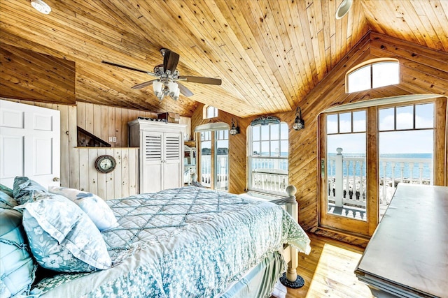 6 Baker Way, West Dennis, MA 02670 - bedroom with vaulted ceiling, wood ceiling, wooden walls, multiple windows, and a water view