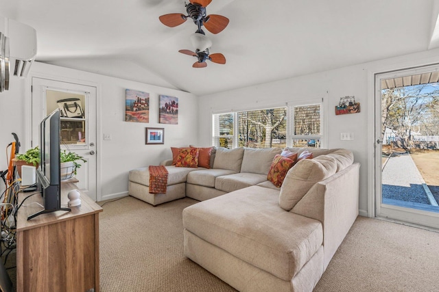 living room with vaulted ceiling, a wall mounted AC, a ceiling fan, and light colored carpet