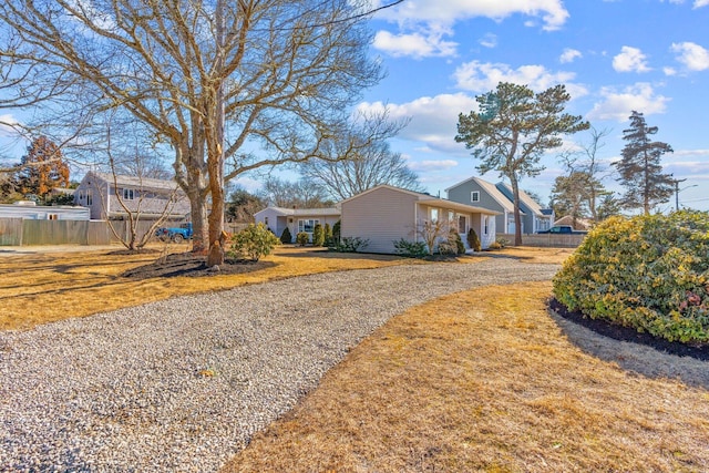 view of front of home featuring a front lawn and fence