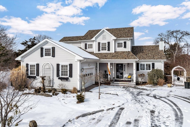 traditional-style house featuring a chimney, a porch, a shingled roof, a gate, and a garage