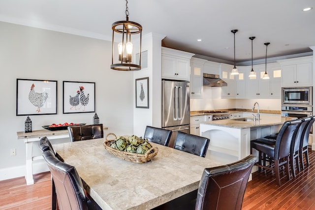 780 Craigville Beach Rd Unit B1, Centerville, MA 02632 - dining area featuring wood finished floors, recessed lighting, baseboards, and crown molding